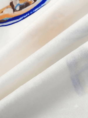 White summer pajama set with holiday motifs and script lettering on the shirt