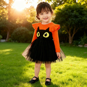 Baby girl halloween costume featuring an orange long sleeve top with ruffle shoulders and a black tulle skirt with cartoon cat eyes design.