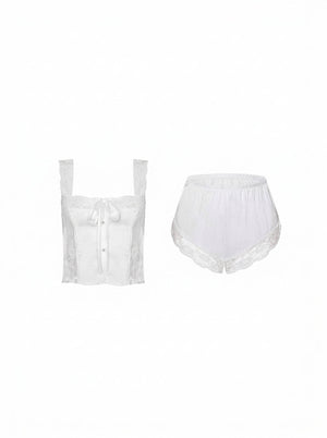 Lace-trimmed two-piece pajama set worn on a model