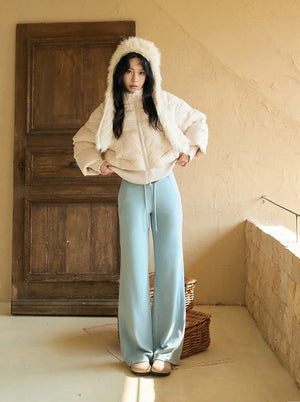 Wide leg fleece lined sweatpants in sea salt blue worn with cream jacket