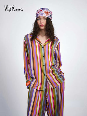 Multicolor striped pajama set seen from the front, notched collar shirt with drawstring pants