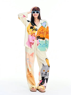 Womens pajama set with colorful cartoon cat print, collared shirt and wide-leg pants