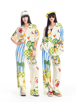 Front view of a colorful graffiti print pajama set with button-front shirt