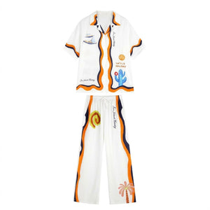 Womens pajama set with camp collar shirt and wide-leg pants in a white wavy stripe print