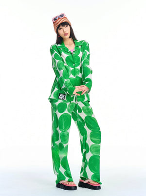 Green polka dot pajama set with long sleeve button-up shirt and wide leg pants