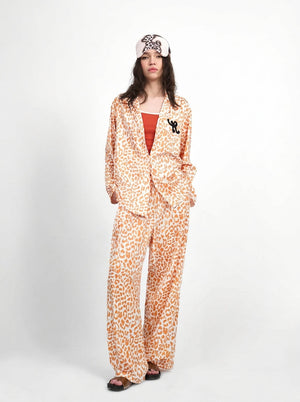 Leopard print pajama set in orange with collared shirt and wide leg pants