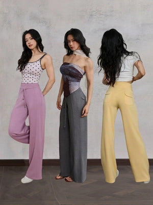 Three models showing front and back views of purple, grey and yellow straight leg sweatpants