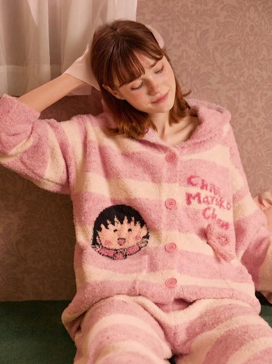 Fleece hooded loungewear set in pink, model sitting front view