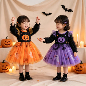 Halloween costume featuring girl’s long-sleeve black top with pumpkin print and puffy layered tulle skirt in orange and purple Halloween colors.