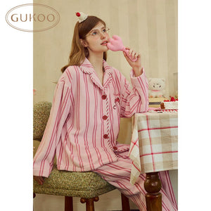 Pink striped fleece lapel pajama set, seated view