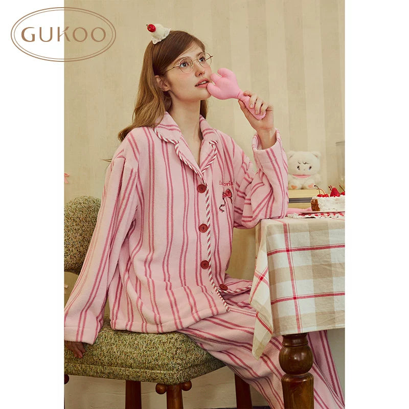Pink striped fleece lapel pajama set, seated view