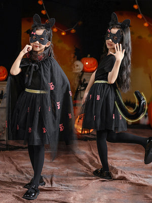 Children's Halloween costumes featuring black cat-themed dresses with pink cat prints, capes, masks, and tails for girls.
