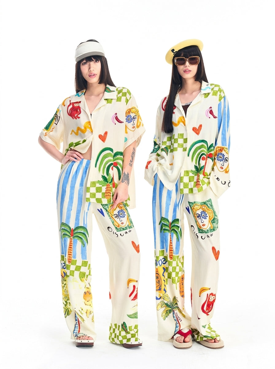 Front view of a colorful graffiti print pajama set with button-front shirt