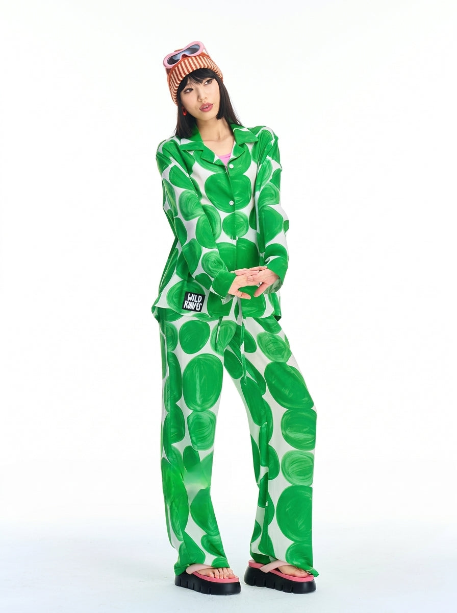 Green polka dot pajama set with long sleeve button-up shirt and wide leg pants